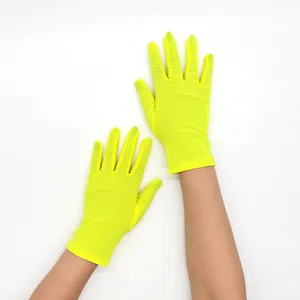 Neon yellow stretch sheer short gloves for women stage performance and sun protection.