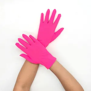 Detail view of women short milk silk stretch bright pink gloves for stage and sun protection