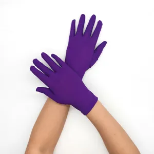 Detail view of women short purple milk silk gloves, lightweight and stretchy performance wear.
