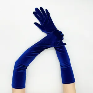 Detail view of long royal blue velvet gloves, elegant evening wear and vintage costume accessory.