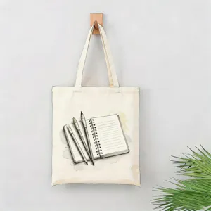 Bolso tote de lona con estampado artístico de cuaderno y pinceles, ideal para el uso diario.