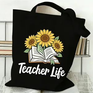 Detailansicht der schwarzen Leinentasche mit Sonnenblumen- und Buchgrafik für Lehrer.