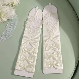 Elegant white satin long gloves with delicate lace floral appliqués and bows for wedding.