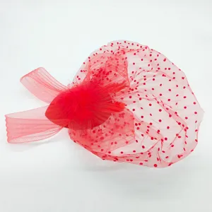 Red retro polka dot mesh fascinator hat detail with feather accessory for vintage events.