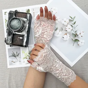 Elegant white floral lace fingerless gloves for women, breathable sun protection design.
