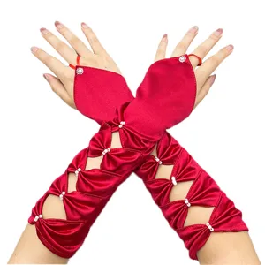 Red satin fingerless wedding gloves with hollow bow pearl details for elegant bridal styling.