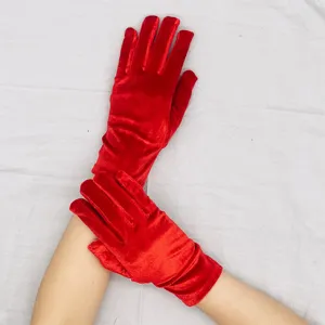 Detail view of red velvet stretch gloves, perfect for winter warmth and party costume accessories.