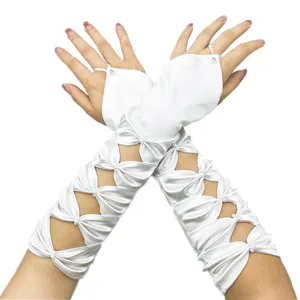 Close-up details of elegant white satin fingerless bridal gloves featuring delicate pearl bow cutouts.