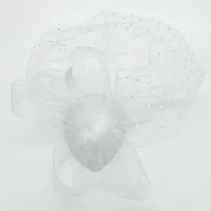 White vintage feather fascinator with polka dot mesh veil for 1920s party and bridal wear.