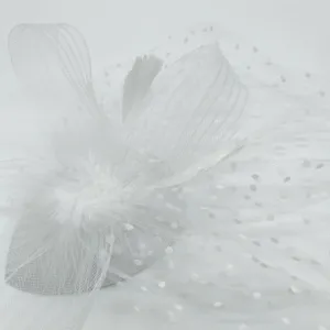 Vintage 1920s bridal white feather mesh veil hair accessory close-up detail shot.