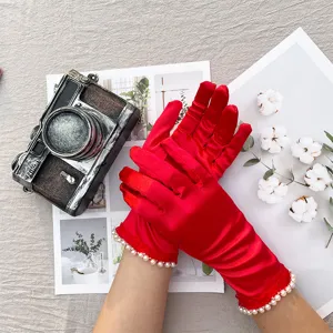 Red satin evening gloves with pearl and lace fringe, elegant bridal wedding ceremony party props.