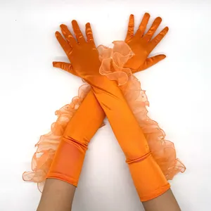 Vintage 1920s orange satin long gloves with ruffled mesh trim and pearls for party.