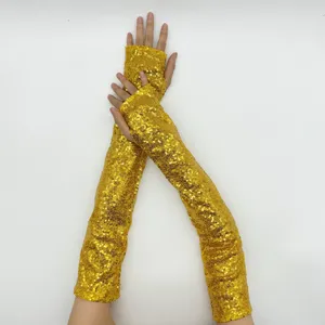 Detail shot of long gold sequin fingerless gloves, perfect for stage and party wear.