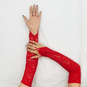 Detailed close-up view of elegant red lace long gloves, floral pattern design, party wear.