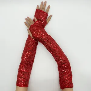 Red sequin long fingerless gloves detail, sparkling stage performance costume accessory.