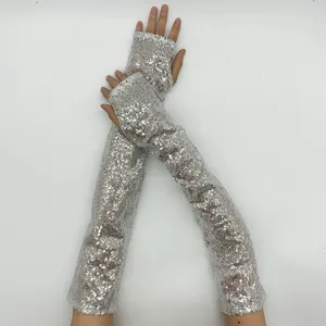 Sparkling long fingerless sequin gloves for stage performance and party wear detail.