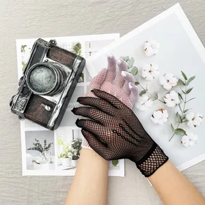 Close up of breathable mesh fishnet gloves detail shot showing delicate texture and elegant design.