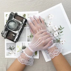 White lace fishnet gloves for women, sheer summer sun protection and elegant wedding wear details.