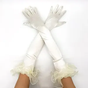 Details of white satin long gloves with ruffled mesh cuffs for retro 1920s vintage party.