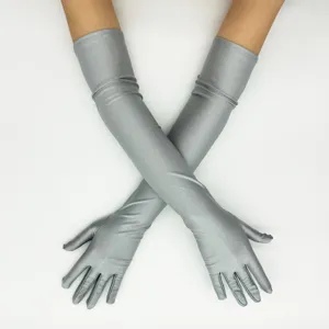 Close-up detail of long silver spandex opera gloves for evening parties and weddings.