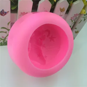 Pink silicone Christmas soap mold with stocking and star design for handmade candles and crafts.