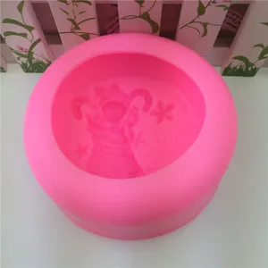 Pink silicone soap candle mold with cute Christmas stocking and star embossed pattern for DIY crafting.