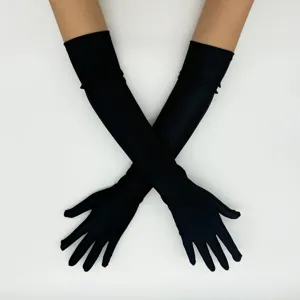 Long black evening gloves detail shot, elastic spandex for elegant vintage party wear.