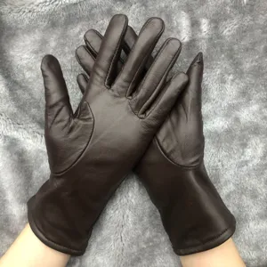 Brown leather gloves detail view, soft sheepskin material, winter warm fingered gloves design.