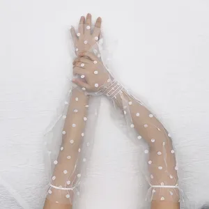 Sheer lace sun protection sleeves with polka dots, long fingerless design for outdoor driving.