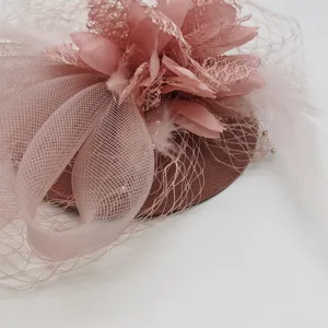 Close-up detail of the pink feather mesh fascinator veil hairpin for women party