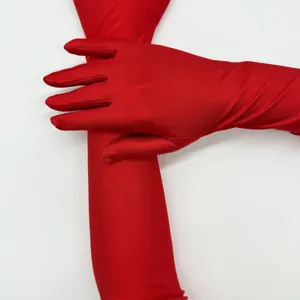 Detailed view of vibrant red long spandex opera gloves, smooth texture close-up for formal wear.