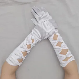 White satin long wedding gloves with hollow bow and pearl details for bridal and stage performance.