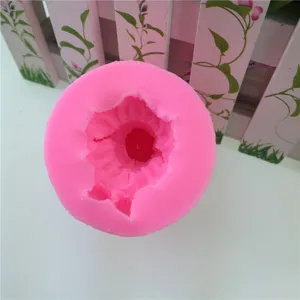 Pink 3D silicone mold detail view, flexible cylinder baking tool for fondant cakes.