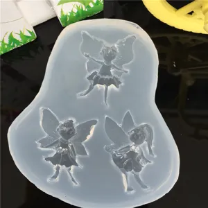 Silicone mold detail showing the three fairy cavity shapes clearly for DIY craft projects.