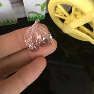 Miniature clear cherry resin figurine close-up detail showcasing exquisite transparent texture.
