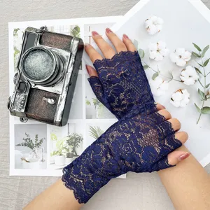 Detailed view of women's floral lace half-finger sunscreen gloves for summer outdoor activities.