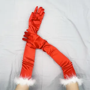 Detail shot of long red satin gloves with white faux fur trim, vintage 1920s style cosplay wear.