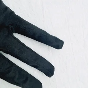 Black velvet long gloves detail view, soft fabric texture close up for women costume party.