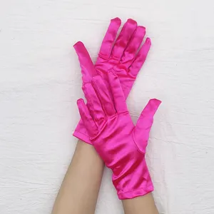 Short stretch satin gloves detail view, vibrant pink color for parties, proms, and evening wear.