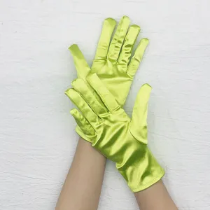 Short stretch green satin gloves for women, smooth formal prom opera performance wear detail.