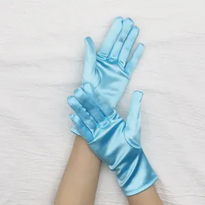 Detail shot of light blue short stretch satin gloves, smooth glossy fabric texture close up view.