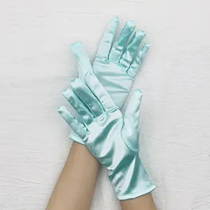 Short satin gloves detail view, elegant light blue party performance and etiquette accessories.