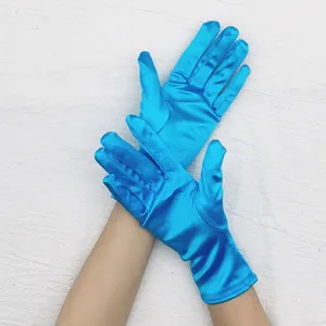 Close-up of bright blue satin short gloves, shiny fabric detail for evening dress and party wear.