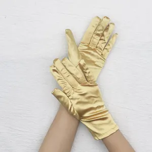 Gold satin short gloves, shiny stretch evening party performance accessories detail.