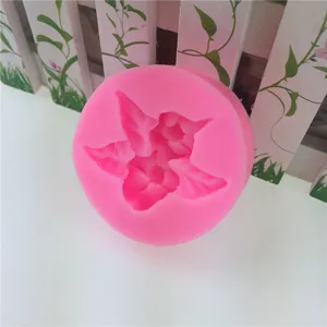 Pink silicone mold detail view, flexible material for baking, cake decorating, and chocolate.