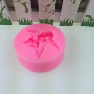 Pink silicone fondant mold for cake baking, flower shape chocolate mold for DIY crafts.