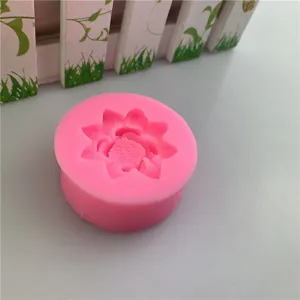 Detail view of a small pink lotus silicone mold showing intricate flower petal texture design.