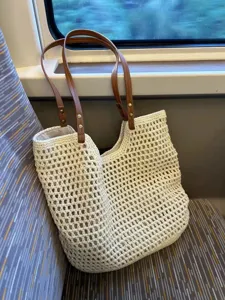 Summer woven straw tote bag for women, large capacity shoulder commuting beach handbag.