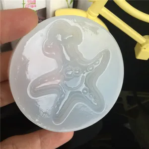 Silicone mold featuring cartoon starfish character, ideal for DIY epoxy resin crafts.