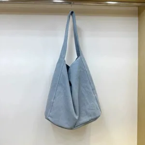 Casual light blue canvas shoulder tote bag detail view, large capacity daily commuting bag.